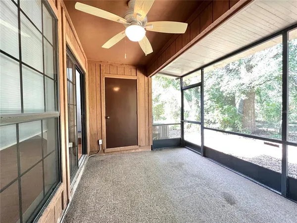 a view of an empty room with a balcony