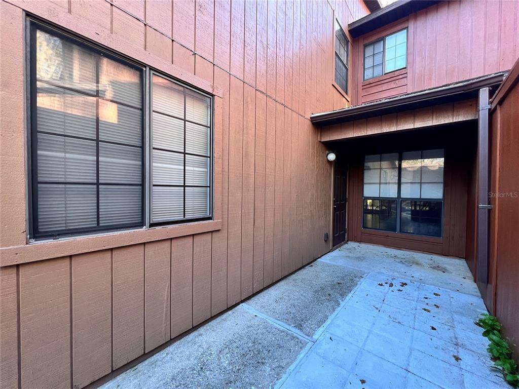 5830 Southwest 9th Place Gainesville, FL 32607 - Photo 3 of 22 a view of a hallway with wooden floor and a cabinet