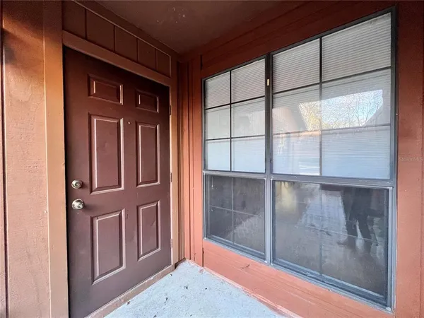 a view of a door and a window