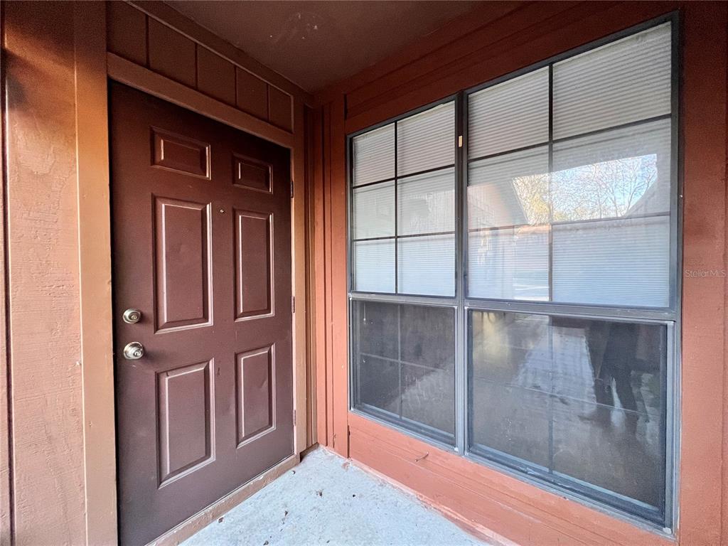 5830 Southwest 9th Place Gainesville, FL 32607 - Photo 4 of 22 a view of a door and a window