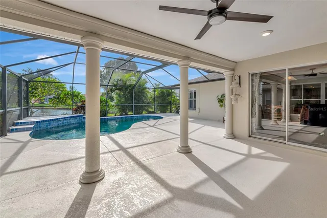 a bedroom with a large bed and a flat screen tv