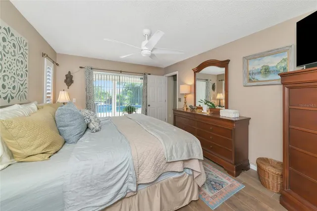 a bathroom with a granite countertop sink toilet and a mirror