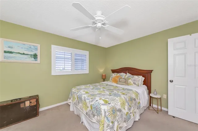 an aerial view of a pool yard and outdoor seating