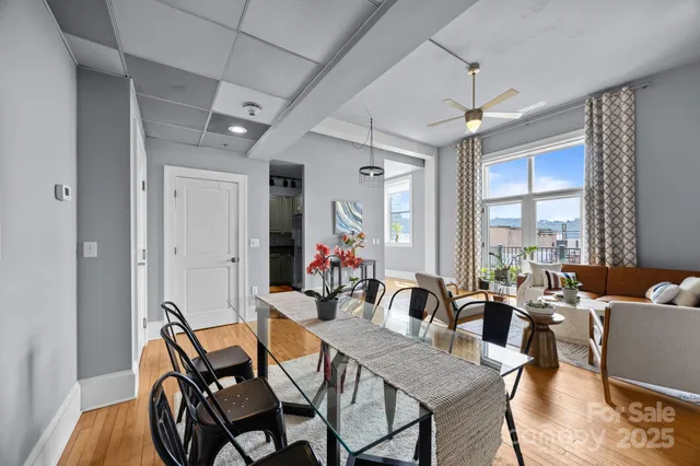 a view of a dining room with furniture window and outside view
