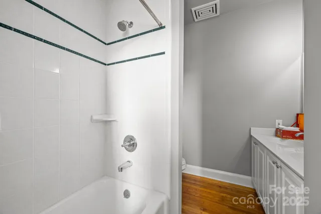 a bathroom with a bathtub and sink