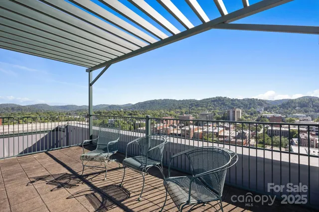 a view of a balcony with lake view and wooden floor