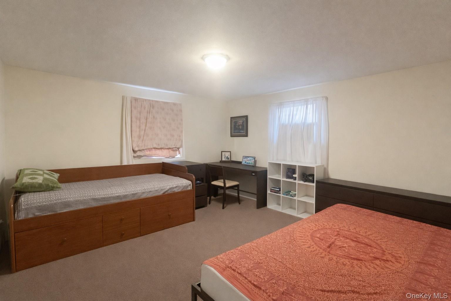 187 Horseblock Road Farmingville, NY 11738 - Photo 4 of 11 Bedroom with light carpet