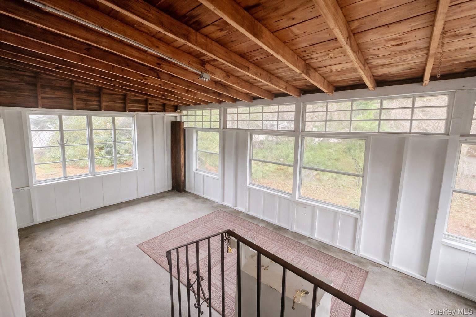 187 Horseblock Road Farmingville, NY 11738 - Photo 9 of 10 Unfurnished sunroom featuring lofted ceiling