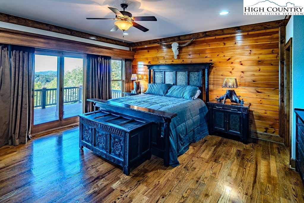 236 Stack Rock Road Elk Park, NC 28622 - Photo 14 of 50 a bed room with a bed and a window