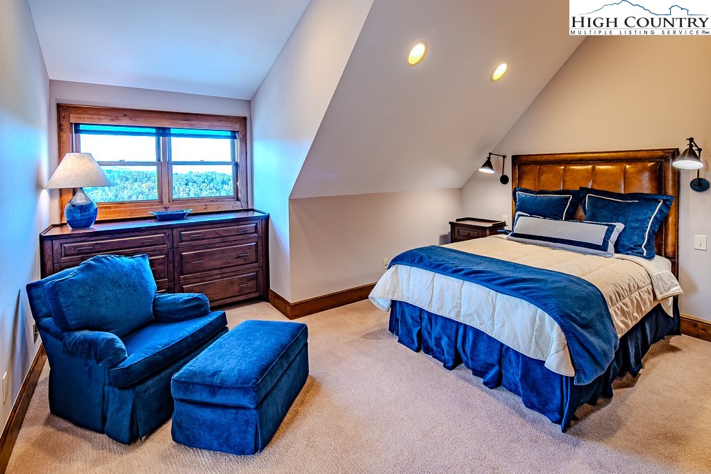 236 Stack Rock Road Elk Park, NC 28622 - Photo 19 of 50 a bedroom with bed and window