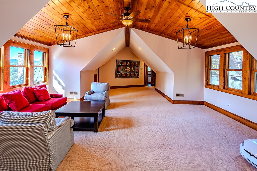236 Stack Rock Road Elk Park, NC 28622 - Photo 21 of 50 a view of a livingroom with furniture and a ceiling fan