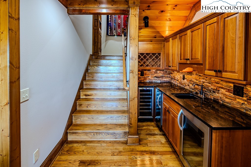 236 Stack Rock Road Elk Park, NC 28622 - Photo 22 of 50 a view of a kitchen with wooden floor and a sink