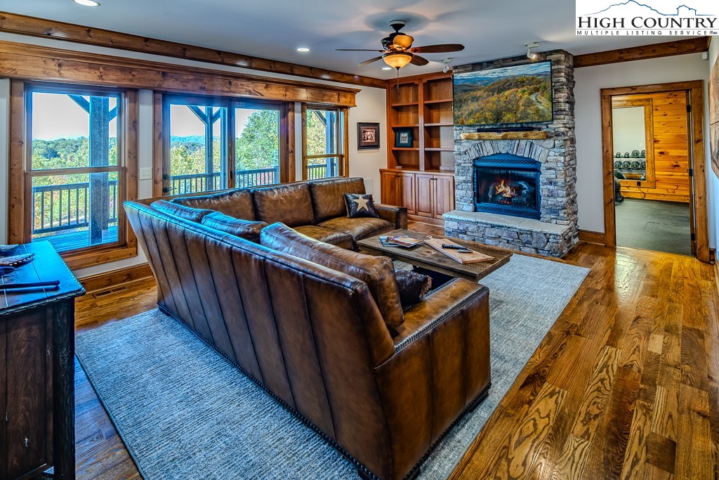 236 Stack Rock Road Elk Park, NC 28622 - Photo 23 of 50 a living room with furniture and a fireplace