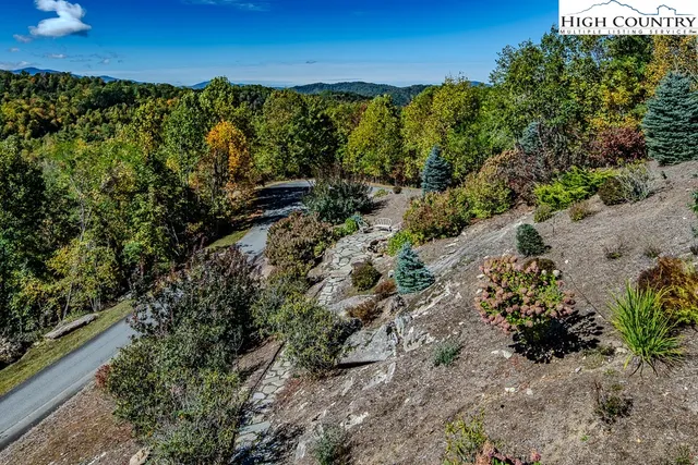 a view of a garden with a building