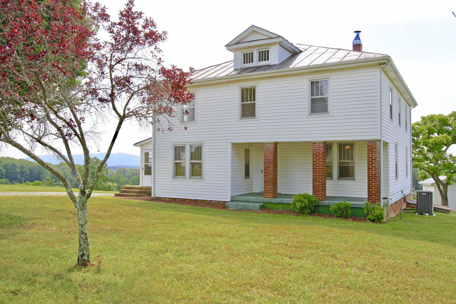 390 Kemp Ford Road Union Hall, VA 24176 - Photo 2 of 47 a front view of house with yard and swimming pool