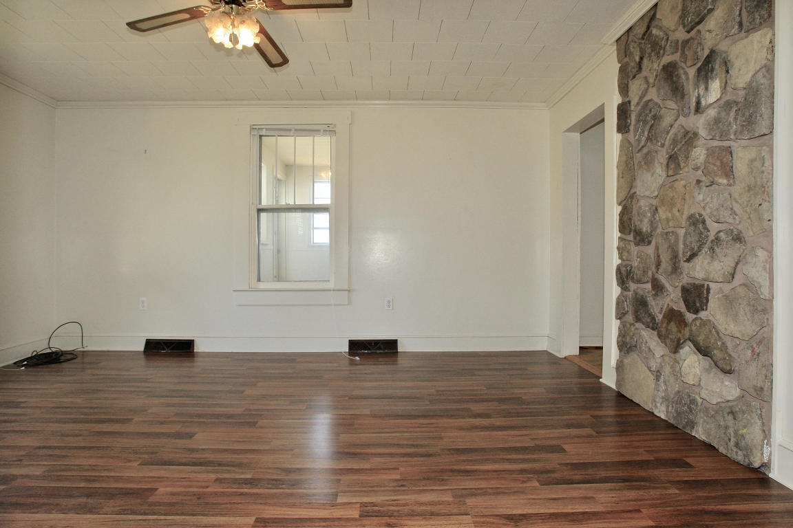 390 Kemp Ford Road Union Hall, VA 24176 - Photo 16 of 47 a view of empty room with a window and wooden floor
