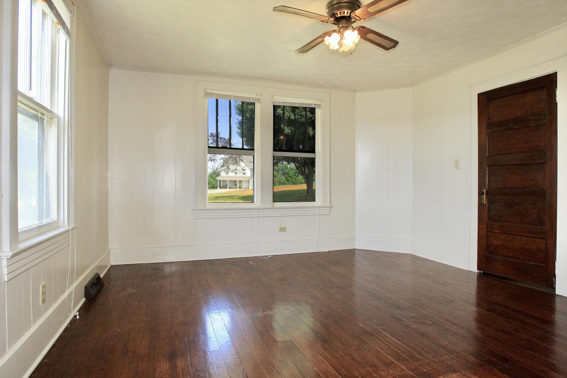 390 Kemp Ford Road Union Hall, VA 24176 - Photo 19 of 47 a view of an empty room with wooden floor and a window