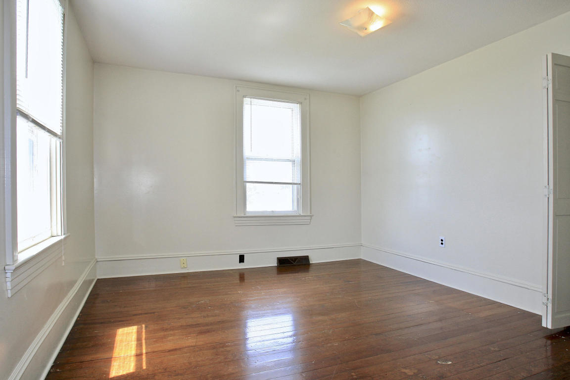 390 Kemp Ford Road Union Hall, VA 24176 - Photo 22 of 47 an empty room with wooden floor and windows