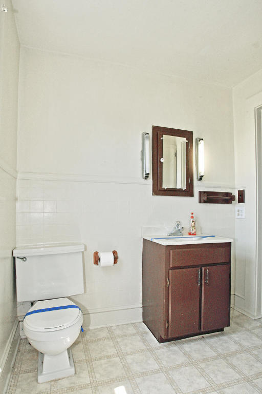 390 Kemp Ford Road Union Hall, VA 24176 - Photo 25 of 47 a bathroom with a toilet a sink and mirror