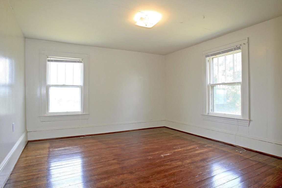 390 Kemp Ford Road Union Hall, VA 24176 - Photo 31 of 47 an empty room with wooden floor and windows