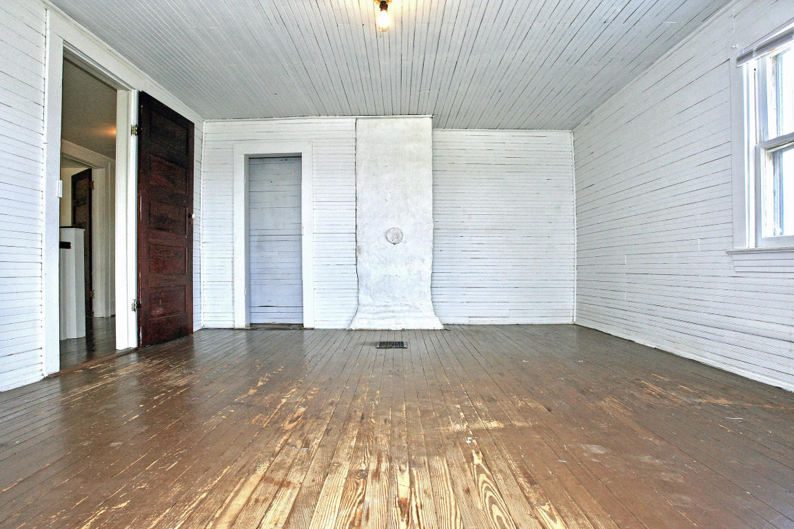 390 Kemp Ford Road Union Hall, VA 24176 - Photo 35 of 47 an empty room with wooden floor and windows