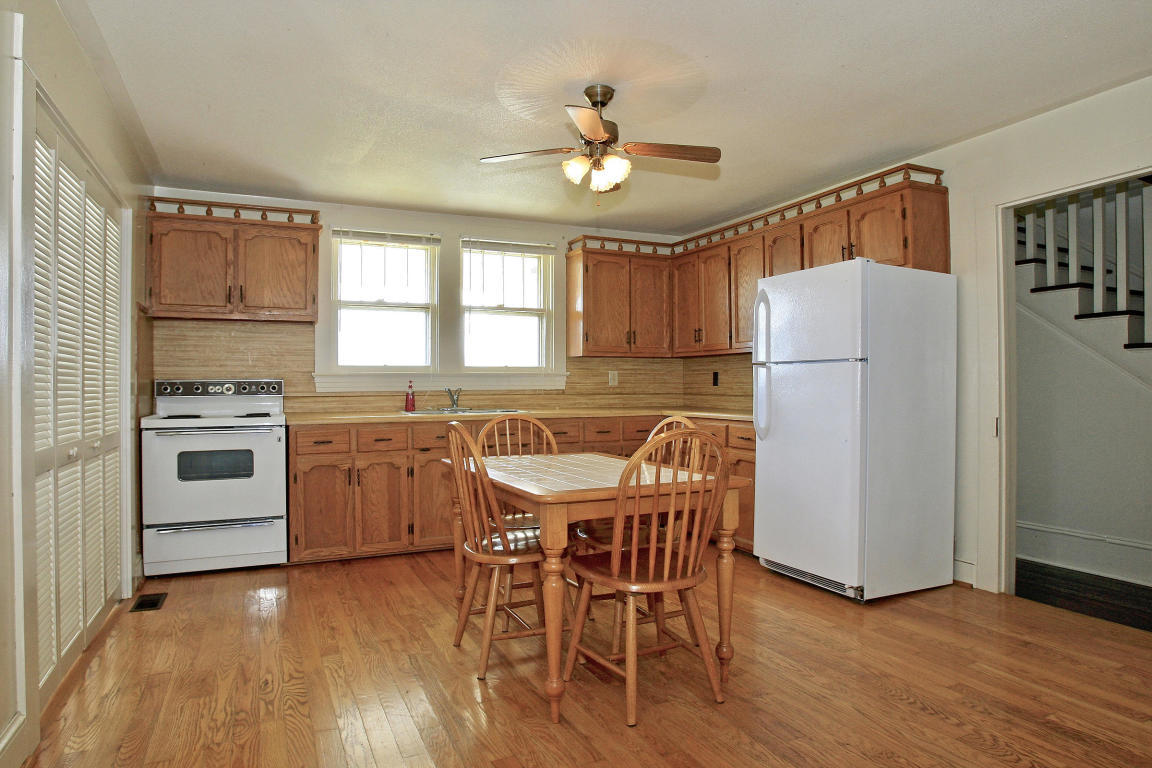 390 Kemp Ford Road Union Hall, VA 24176 - Photo 8 of 47 a kitchen with stainless steel appliances a dining table chairs stove and refrigerator