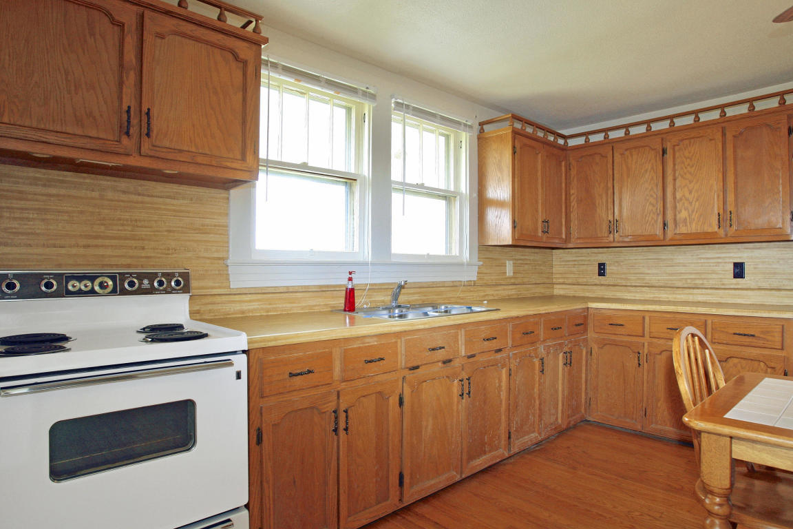 390 Kemp Ford Road Union Hall, VA 24176 - Photo 9 of 47 a kitchen with stainless steel appliances granite countertop a sink stove and cabinets