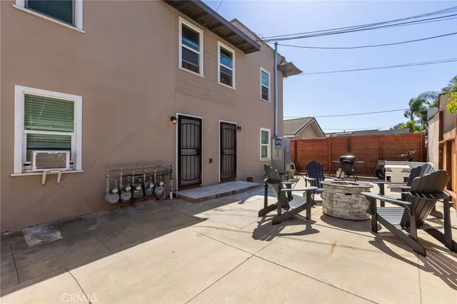 a view of backyard with wheel chair and potted plants