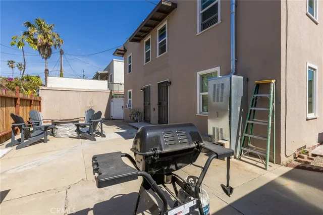 a view of a dinning room with a table and chairs