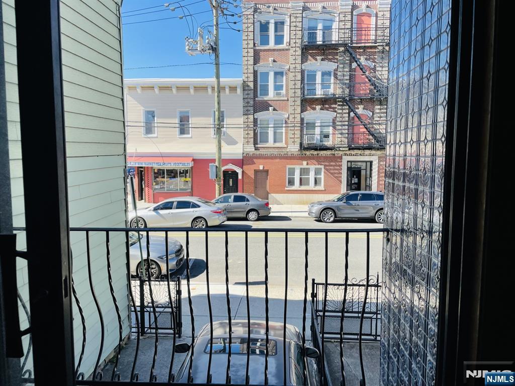 303 North 3rd Street, Unit 1 Harrison, NJ 07029 - Photo 11 of 11 a view of a balcony with a small yard