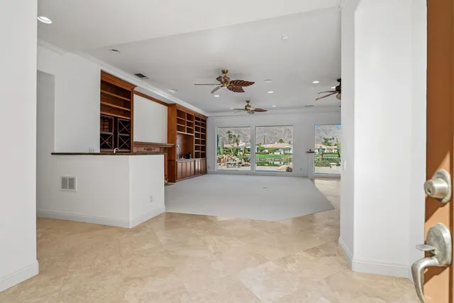 a utility room with cabinets washer and dryer