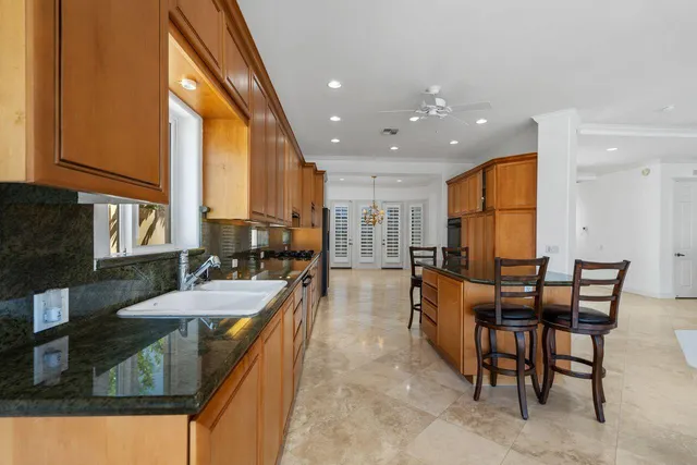 a spacious bathroom with a granite countertop tub shower and sink