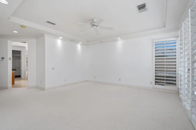 a view of a house with swimming pool and furniture