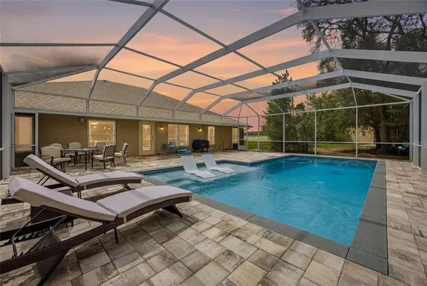 an aerial view of swimming pool and yard