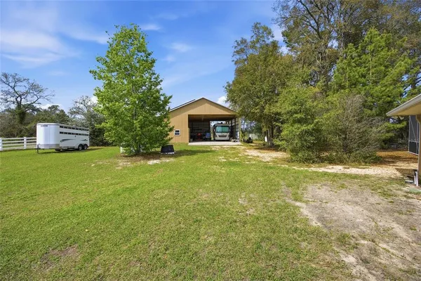 a view of staircase with a black gate