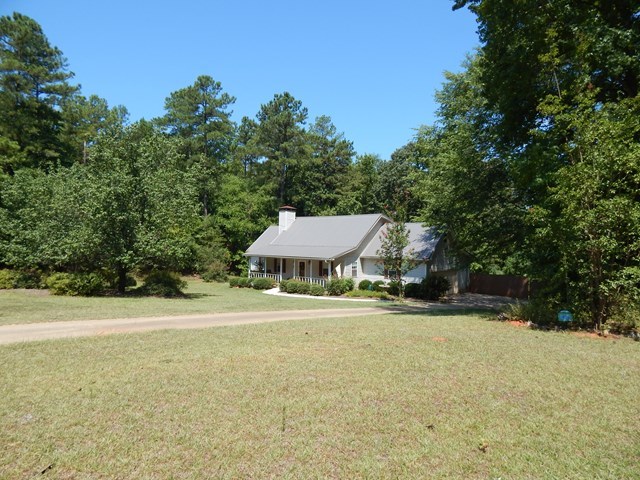 826 McKay Road Gray, GA 31032 - Photo 2 of 28 a view of a big yard with plants and large trees