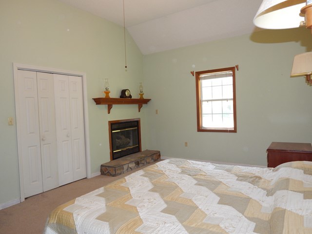 826 McKay Road Gray, GA 31032 - Photo 13 of 28 a bedroom with a bed and a television