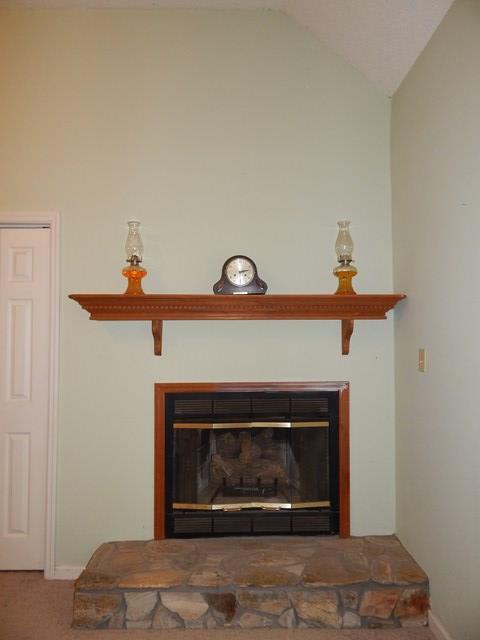 826 McKay Road Gray, GA 31032 - Photo 14 of 28 a fireplace with a clock on top of it