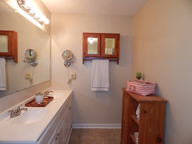 826 McKay Road Gray, GA 31032 - Photo 16 of 28 a bathroom with a sink a mirror and vanity
