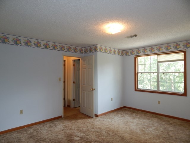 826 McKay Road Gray, GA 31032 - Photo 21 of 28 a view of an empty room with a window