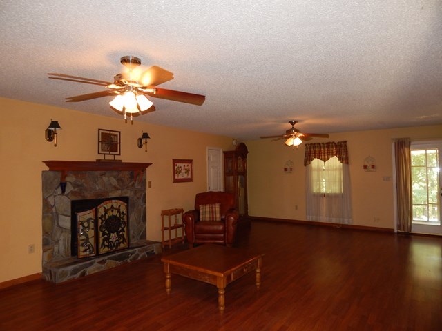 826 McKay Road Gray, GA 31032 - Photo 5 of 28 a living room with furniture and a fireplace