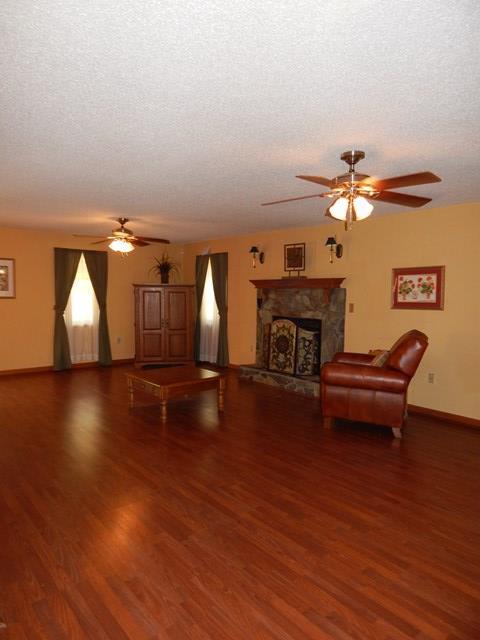 826 McKay Road Gray, GA 31032 - Photo 7 of 28 a living room with furniture and a wooden floor
