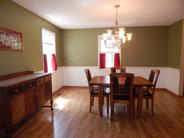 826 McKay Road Gray, GA 31032 - Photo 9 of 28 a view of a dining room with furniture window and wooden floor
