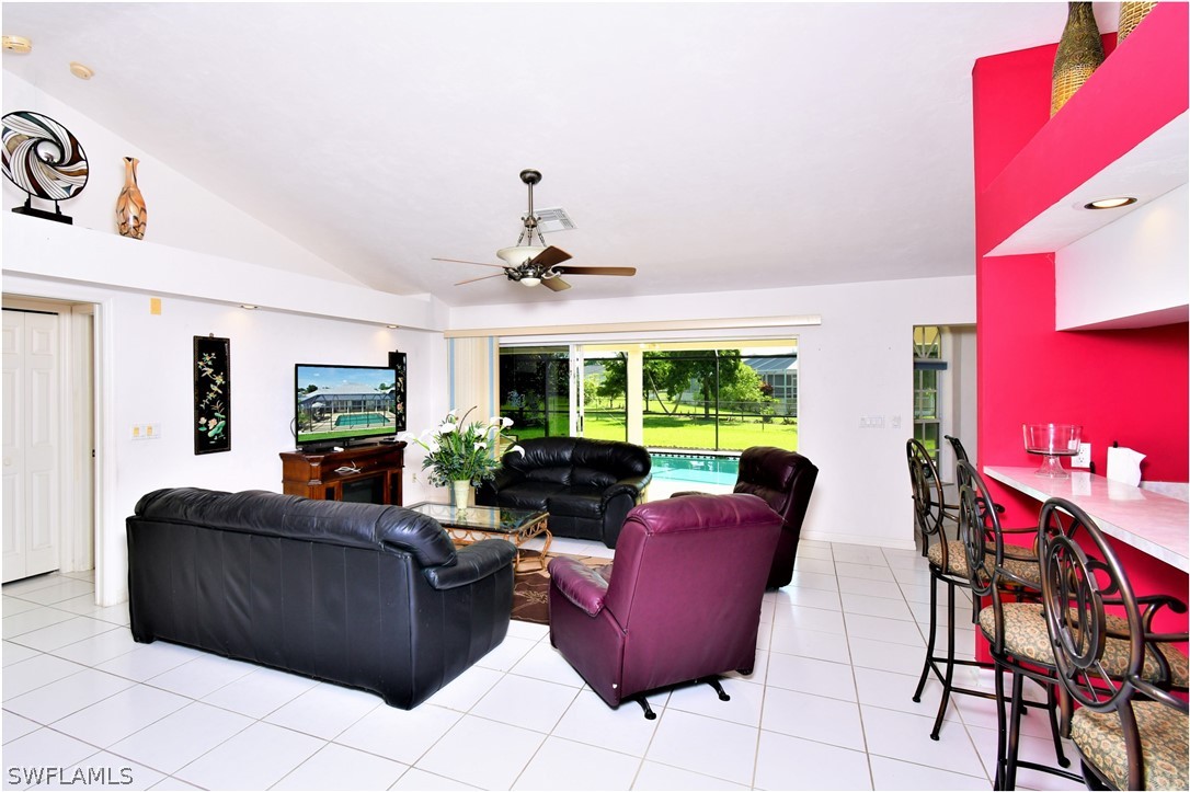 517 Marby Road Lehigh Acres, FL 33936 - Photo 4 of 29 a living room with furniture and a large window