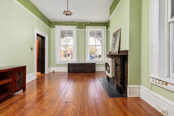 a view of entryway with wooden floor and stairs