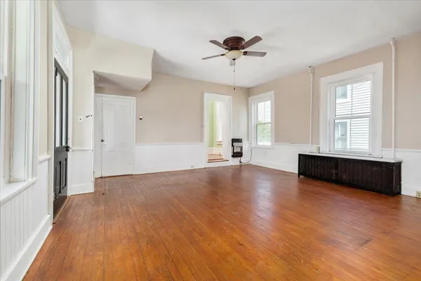 a large kitchen with a sink and a stove top oven