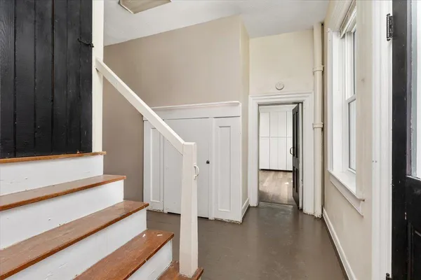 a kitchen with stainless steel appliances a stove a microwave and cabinets