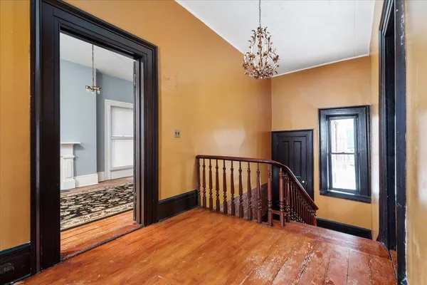 a room with a bed and a window