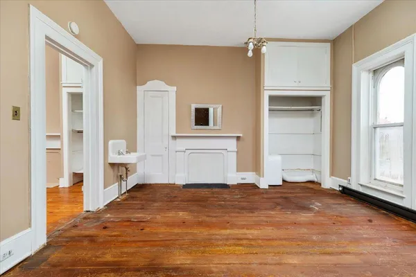 a front view of a residential apartment building with a yard