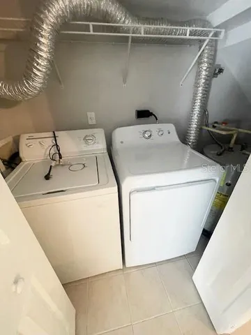 a utility room with dryer and washer